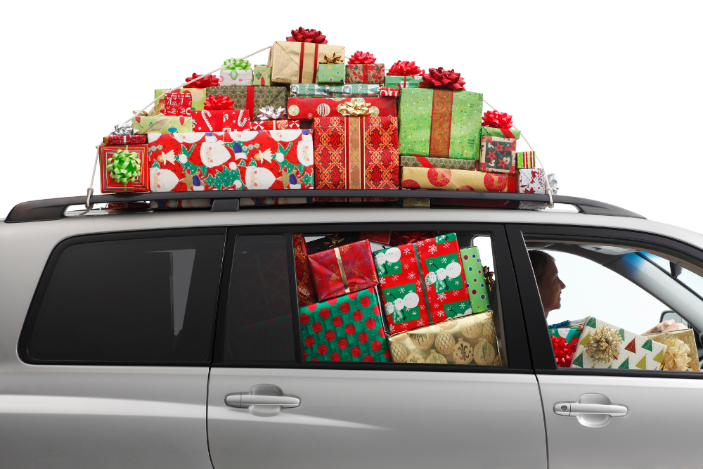 Car filled with presents inside and on the roof.