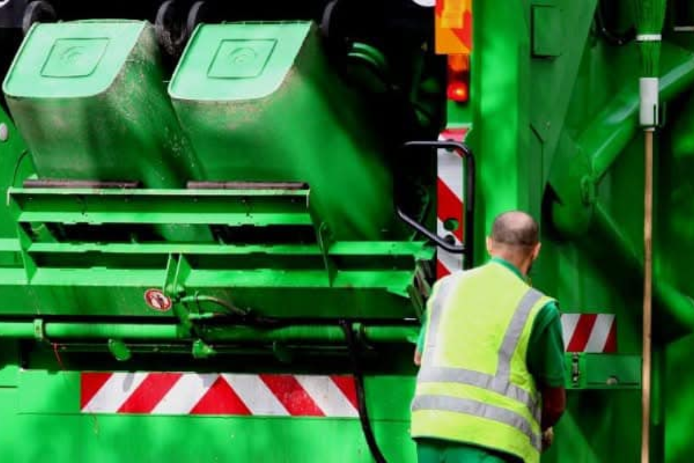 Bin man emptying waste bins.